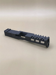 Kineti‑Tech Raptor Cut Stripped Slide for Glock 17 Gen 3 featuring aggressive lightening cuts, micro‑raptor serrations, RMR optic cut, and Armor Black Cerakote. USA‑made and ready for your custom build.

Kineti‑Tech Glock 17 Gen 5 Raptor Cut stripped slide with lightening windows and micro‑raptor serrations, angled front‑side view.