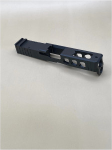 Angled view of the Kineti-Tech LWP Stripped Slide for Glock® 45 Gen 5 in Armor Black CERAKOTE® finish. Features lightening window cuts for weight reduction, large port for gas venting, and RMR optic cut for micro red dot compatibility.

Armor Black Kineti-Tech LWP Stripped Slide for Glock 45 Gen 5 with lightening cuts, ported design, and RMR optic cut.