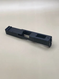 Angled view of the Kineti‑Tech Ported Stripped slide showing the aggressive front and rear serrations, top porting, and the Cerakote® finish designed for improved slide manipulation and rapid shot recovery.

Kineti‑Tech Ported Black Stripped Slide for Glock 45 Gen 5 shown at an angle with top porting and serrated slide cuts.