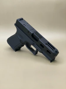 The Kineti‑Tech Aero Complete Slide for Glock® 19 Gen 3 features dual lightening ports, deep-cut serrations, RMR® optic cut, Cerakote® finish, and a 416R stainless barrel.

Kineti‑Tech Aero Complete Slide for Glock 19 Gen 3 with RMR cut, deep rear serrations, and high‑speed lightening window ports.
