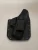 Black carbon fiber texture holster with black belt clip attached, shown from the front with visible rivets and smooth molded edges.

Black carbon fiber texture Kydex holster for Glock 43/43X with belt clip and riveted edges.