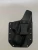 Black carbon fiber kydex texture holster with black belt clip attached, shown from the front with visible rivets and smooth molded edges.

Black carbon fiber kydex texture holster for Glock 19 Gen 1-5 with belt clip and riveted edges.