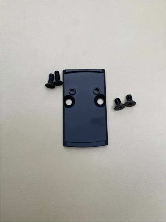 Kineti-Tech RMR to RMSc Black adapter plate with included mounting screws displayed on a neutral background. Precision-machined plate designed for Glock 17, 19, and 26 RMR cut slides to support RMSc optics.

RMR to RMSc Black adapter plate with screws for Glock 17 19 26 optic conversion.