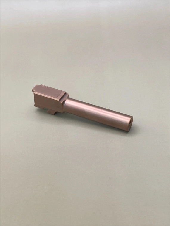 Precision‑machined copper‑finished barrel made in the USA from 416R stainless steel with a smooth PVD coating. Designed for 9mm platforms and crafted for consistent performance and durability.

Copper‑finished 9mm stainless steel Glock 19 Gen 1-5 barrel shown at an angle on a neutral background.