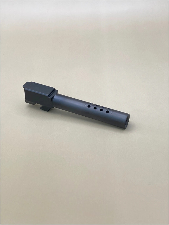 Angled view of a Glock 17 Gen 1-4 Black ported barrel on a light background, showing the top ports and smooth DLC‑coated exterior.

Black DLC‑coated 9mm ported pistol barrel made from 416R stainless steel, Glock 17 Gen 1-4 compatible, side view.