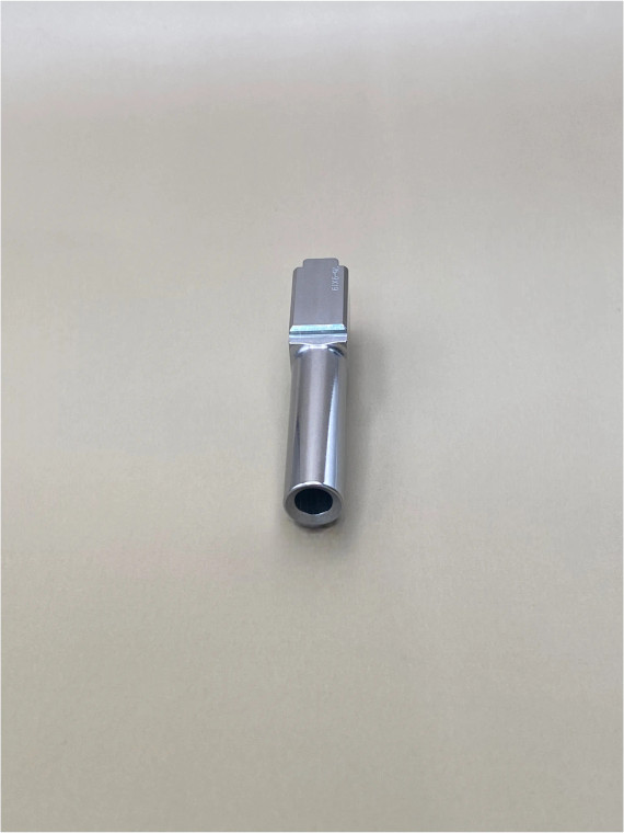 Front view of a Glock 26 Gen 1-4 replacement 9mm barrel showing precision machining and polished stainless steel construction, designed to maintain factory fit and smooth feed reliability.

Glock 26 stainless steel 9mm barrel front view – polished drop‑in replacement