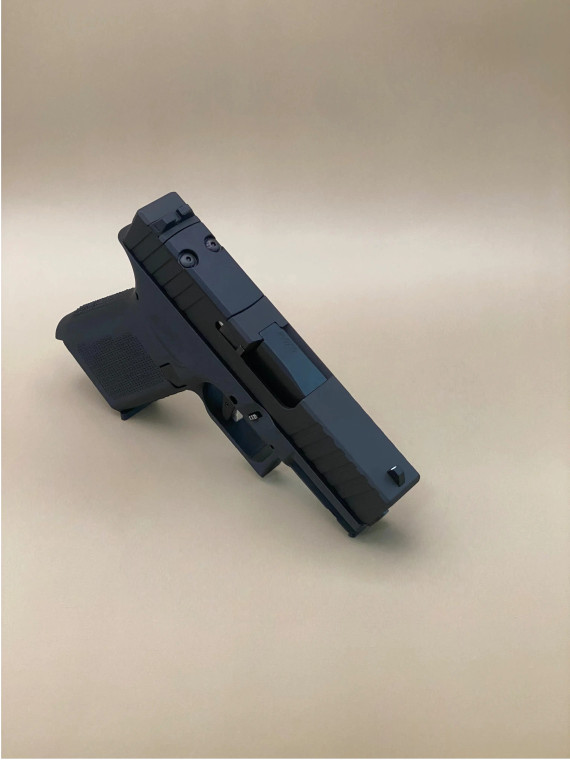 Side profile view of the Kineti-Tech Serrated Beveled Complete Slide mounted on a Glock® 43/43X frame in Armor Black CERAKOTE® finish. The image highlights the beveled edges, deep serrations, and durable finish designed for duty and defense applications.

Side view of Kineti-Tech Serrated Beveled Slide for Glock 43/43X in Armor Black CERAKOTE® finish.