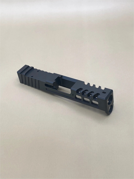 Kineti‑Tech Raptor Cut Stripped Slide for Glock 43/43x featuring aggressive lightening cuts, micro‑raptor serrations, RMSc optic cut, and Armor Black Cerakote. USA‑made and ready for your custom build.

Kineti‑Tech Glock 43/43x Raptor Cut stripped slide with lightening windows and micro‑raptor serrations, angled front‑side view.
