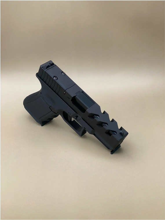 Kineti-Tech Predator Beveled Complete Slide for Glock 19 Gen 3 in Armor Black Cerakote finish, featuring aggressive Raptor-style lightening cuts and rear optic cut for Trijicon RMR footprint.

Kineti‑Tech Predator Beveled Glock 19 Gen 3 slide in Armor Black Cerakote with Raptor‑style lightening cuts and rear Trijicon RMR optic cut.