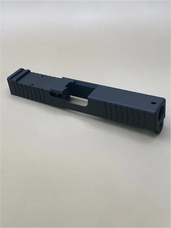 Image of the Kineti‑Tech Glock 19 Gen 3 Serrated Stripped Slide in Armor Black Cerakote, featuring deep‑cut front and rear serrations, and an RMR optic cut for custom pistol builds.

Kineti‑Tech Glock 19 Gen 3 Serrated Stripped Slide with Armor Black CERAKOTE® finish with optic cut and serrations.
