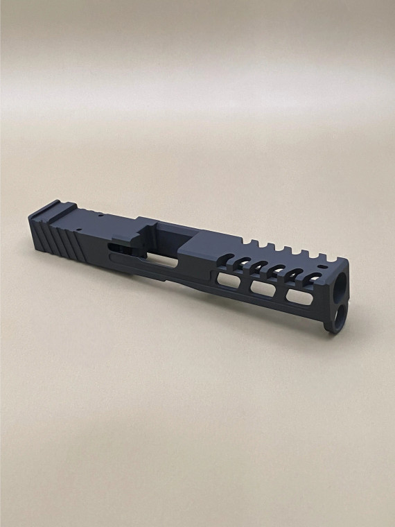 Kineti‑Tech Raptor Cut Stripped Slide for Glock 17 Gen 3 featuring aggressive lightening cuts, micro‑raptor serrations, RMR optic cut, and Armor Black Cerakote. USA‑made and ready for your custom build.

Kineti‑Tech Glock 17 Gen 5 Raptor Cut stripped slide with lightening windows and micro‑raptor serrations, angled front‑side view.