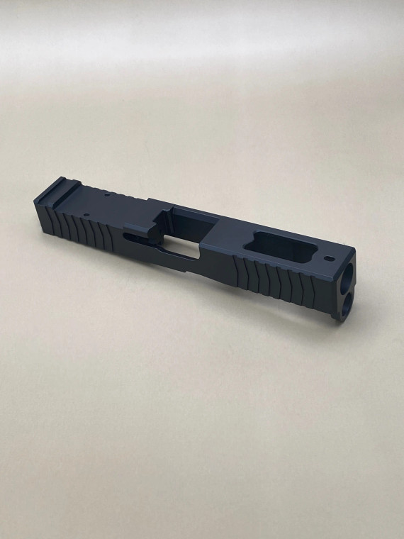 Angled view of the Kineti‑Tech Ported Stripped slide showing the aggressive front and rear serrations, top porting, and the Cerakote® finish designed for improved slide manipulation and rapid shot recovery.

Kineti‑Tech Ported Black Stripped Slide for Glock 19 Gen 5/19X shown at an angle with top porting and serrated slide cuts.