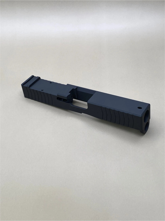 Image of the Kineti‑Tech Glock 45 Gen 5 Serrated Beveled Stripped Slide in Armor Black Cerakote, featuring deep‑cut front and rear serrations, beveled edges, and an RMR optic cut for custom pistol builds.

Kineti‑Tech Glock 45 Gen 5 Serrated Beveled Stripped Slide with Armor Black Cerakote, showing front serrations and beveled cuts.