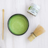 Organic Ceremonial Matcha tin 30g with a whisk and bowl of matcha and scoop