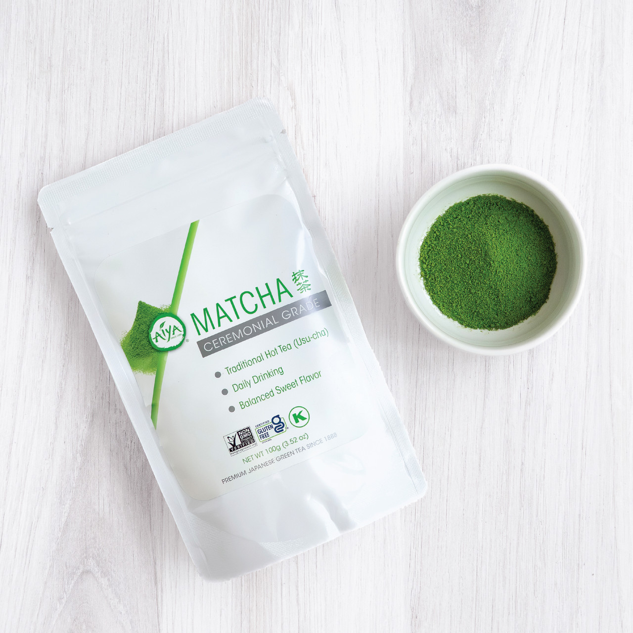 Ceremonial Matcha Bag 100g with bowl of Matcha powder