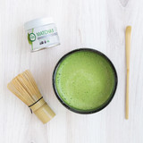 Ceremonial Matcha tin 30g with whisk and scoop and bowl of matcha