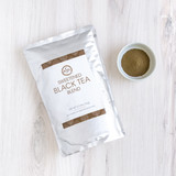 Sweetened Black Tea Blend 1kg bag with bowl of black tea powder