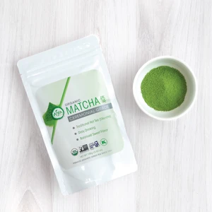 Organic Ceremonial Matcha bag 100g with bowl of Matcha powder