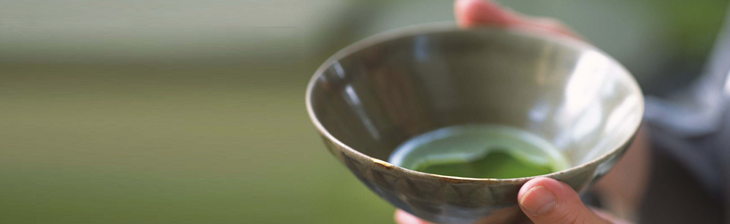 Brown Matcha bowl filled with Ceremonial Matcha