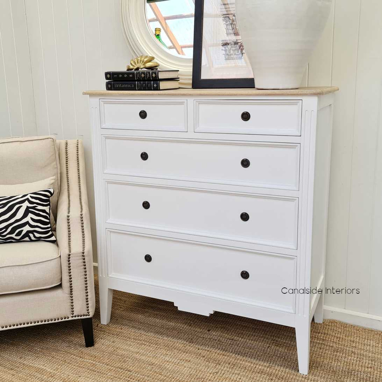 The chest set in a minimalistic modern lounge, proving its ability to elevate any space with its timeless charm.