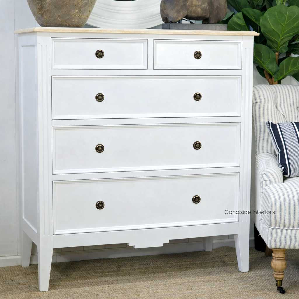 Angled view of the Peninsula 5 Drawer Chest in white with limewash top, highlighting the chest's straight lines and minor distressing, marrying traditional craftsmanship with modern elegance.