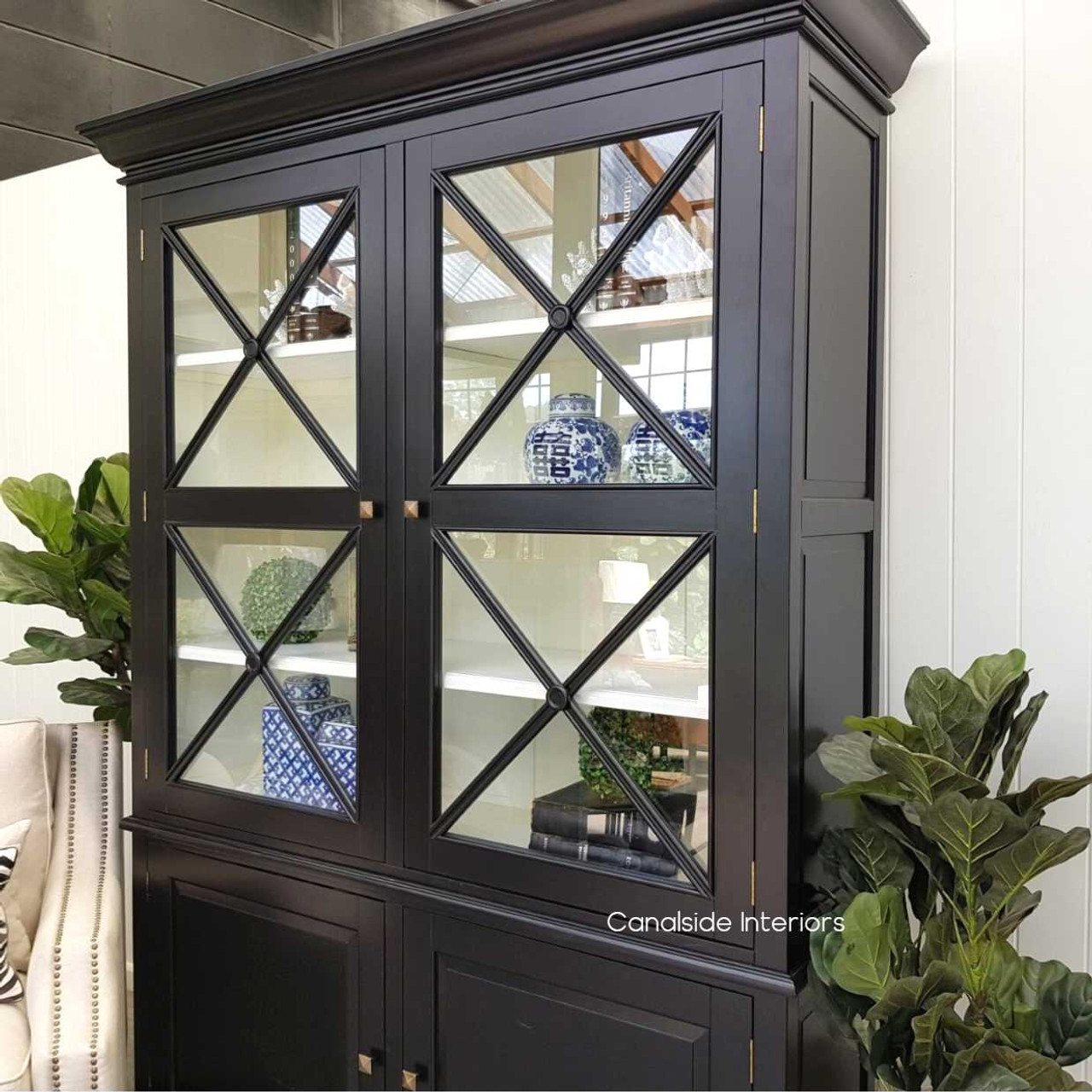 Canalside Interiors features a chic black & white 2 Door Wall Unit, combining Hamptons style with contemporary design for a striking living room statement