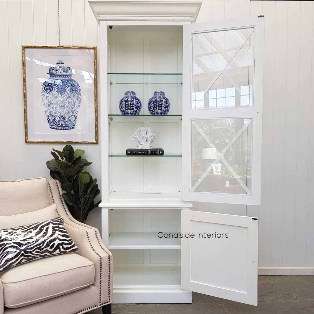 Canalside Interiors presents the South Hamptons Display Unit, perfect for showcasing decor in a classical bedroom setting with its white distressed finish
