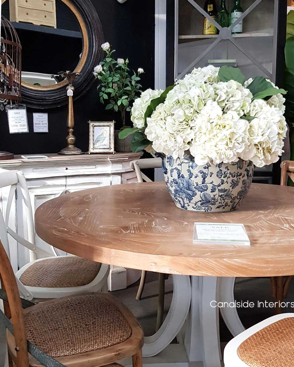 The table set in a rustic Hamptons-style dining room, illustrating its versatility and harmonious fit within various decor themes.
