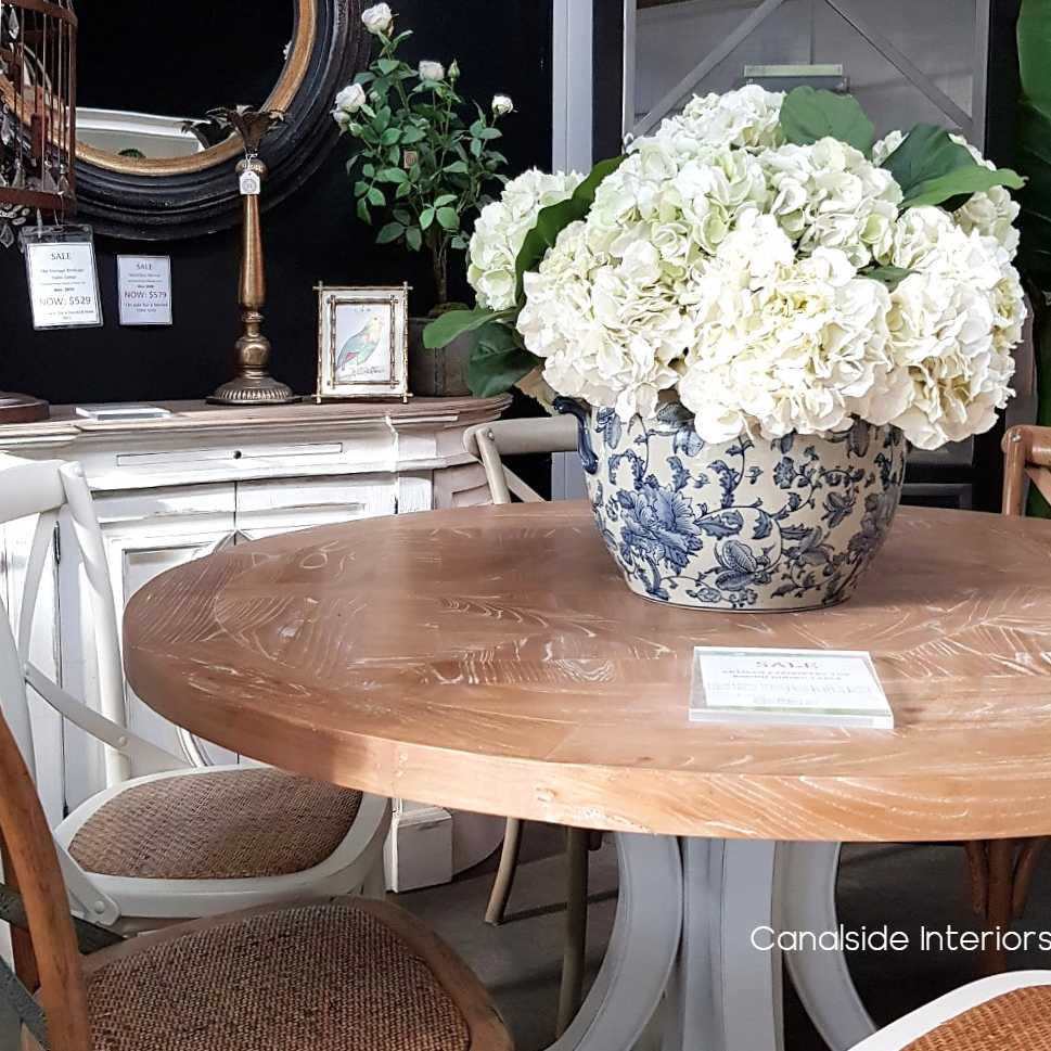 The table set in a rustic Hamptons-style dining room, illustrating its versatility and harmonious fit within various decor themes.