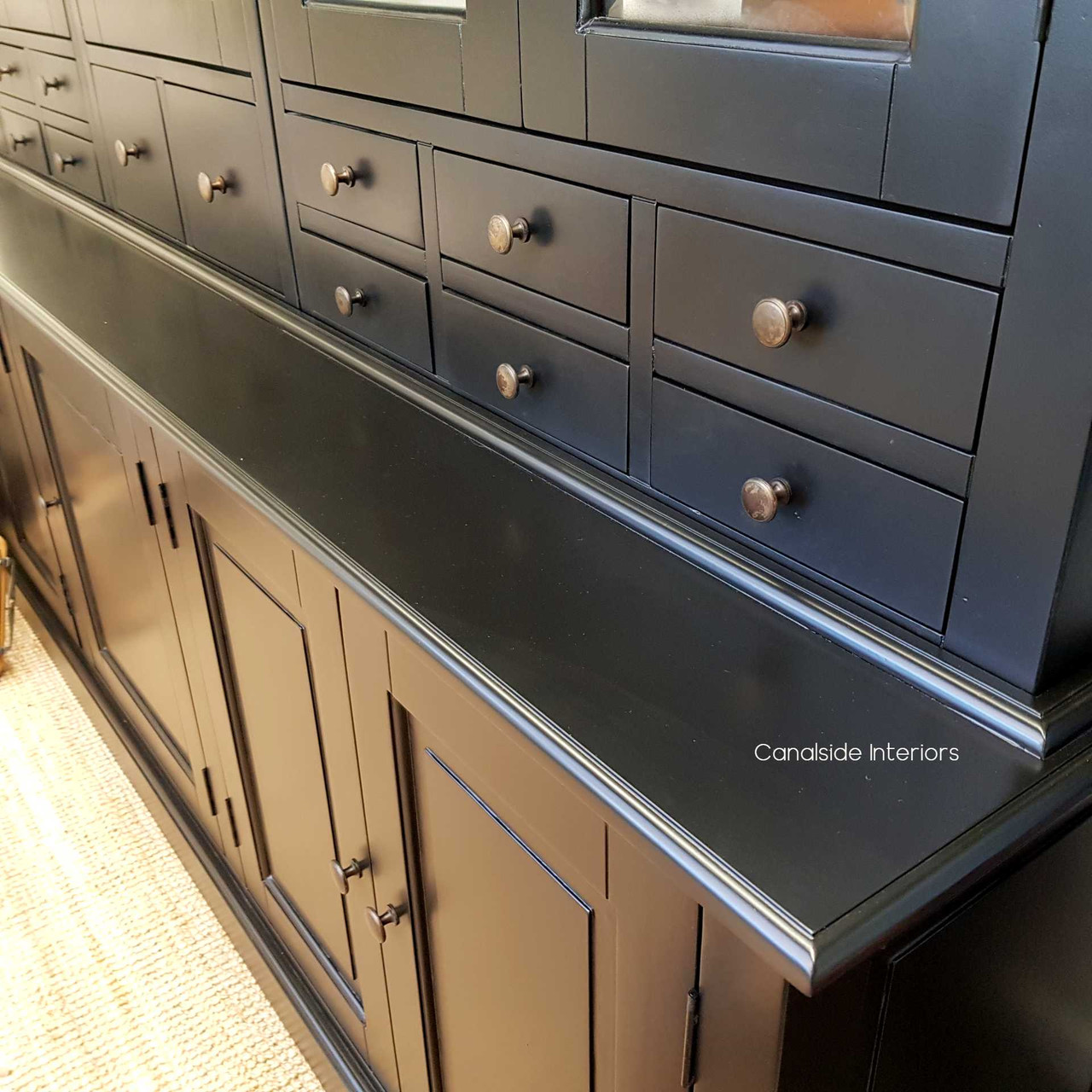A modern classic, the Key Largo Display Unit features a sophisticated black finish ideal for any dining room interior – Canalside Interiors
