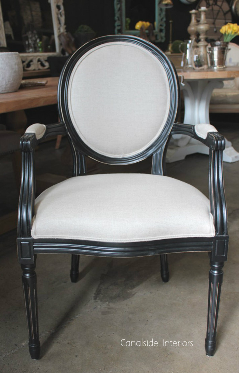 In a library setting, the Sansa Carver Chair invites timeless sophistication, blending seamlessly with classical themes