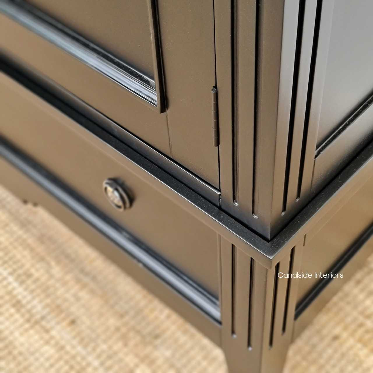 Detailed view of the wardrobe's handle design, marrying functionality with aesthetic beauty for a minimalist yet traditional look.