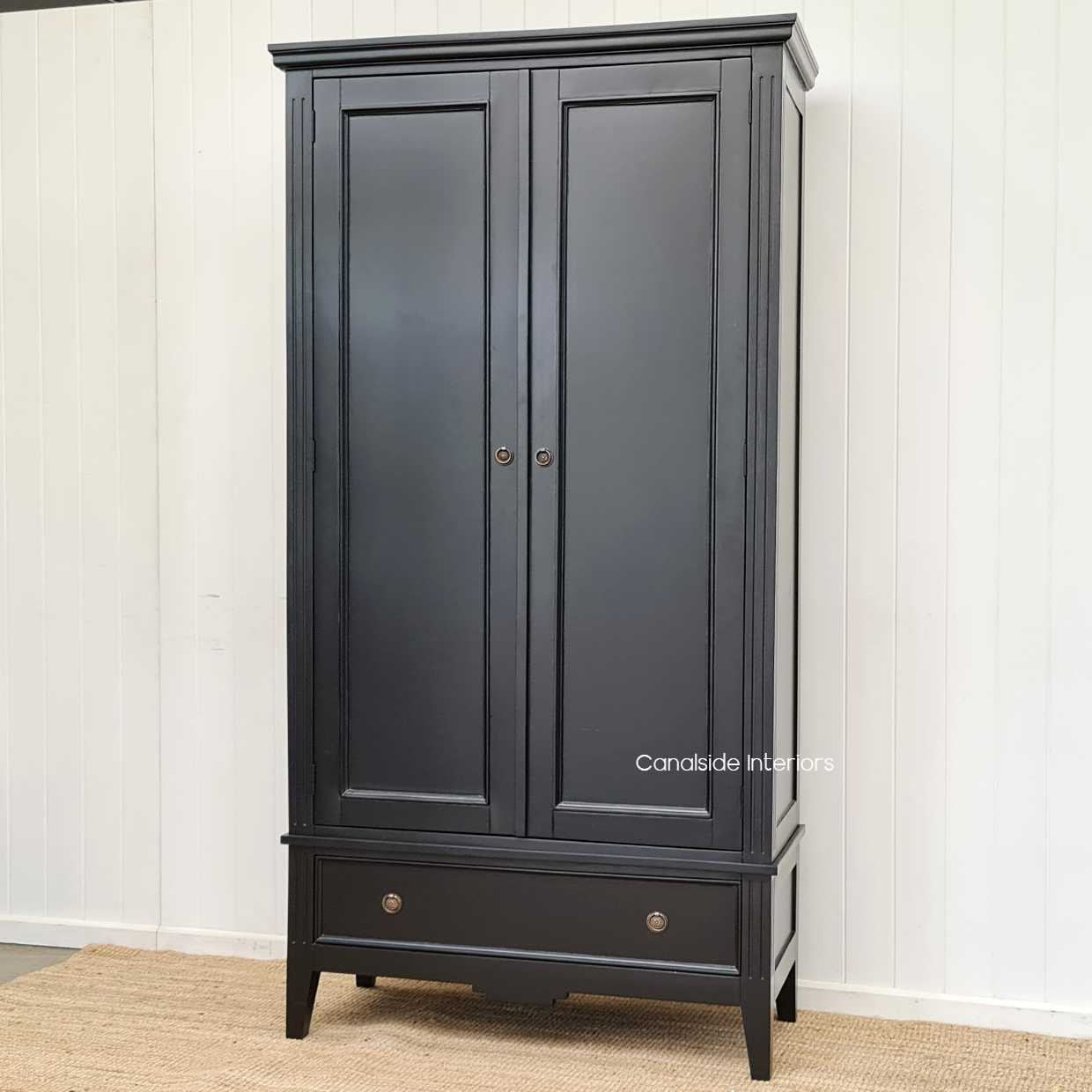 Side perspective of the wardrobe, capturing its depth and quality construction, perfect for both modern and traditional decors.