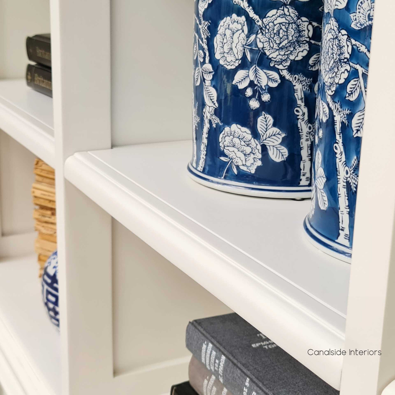 The Grange Wall Unit, with its modern flair, is the perfect complement to a coastal bedroom's aesthetic