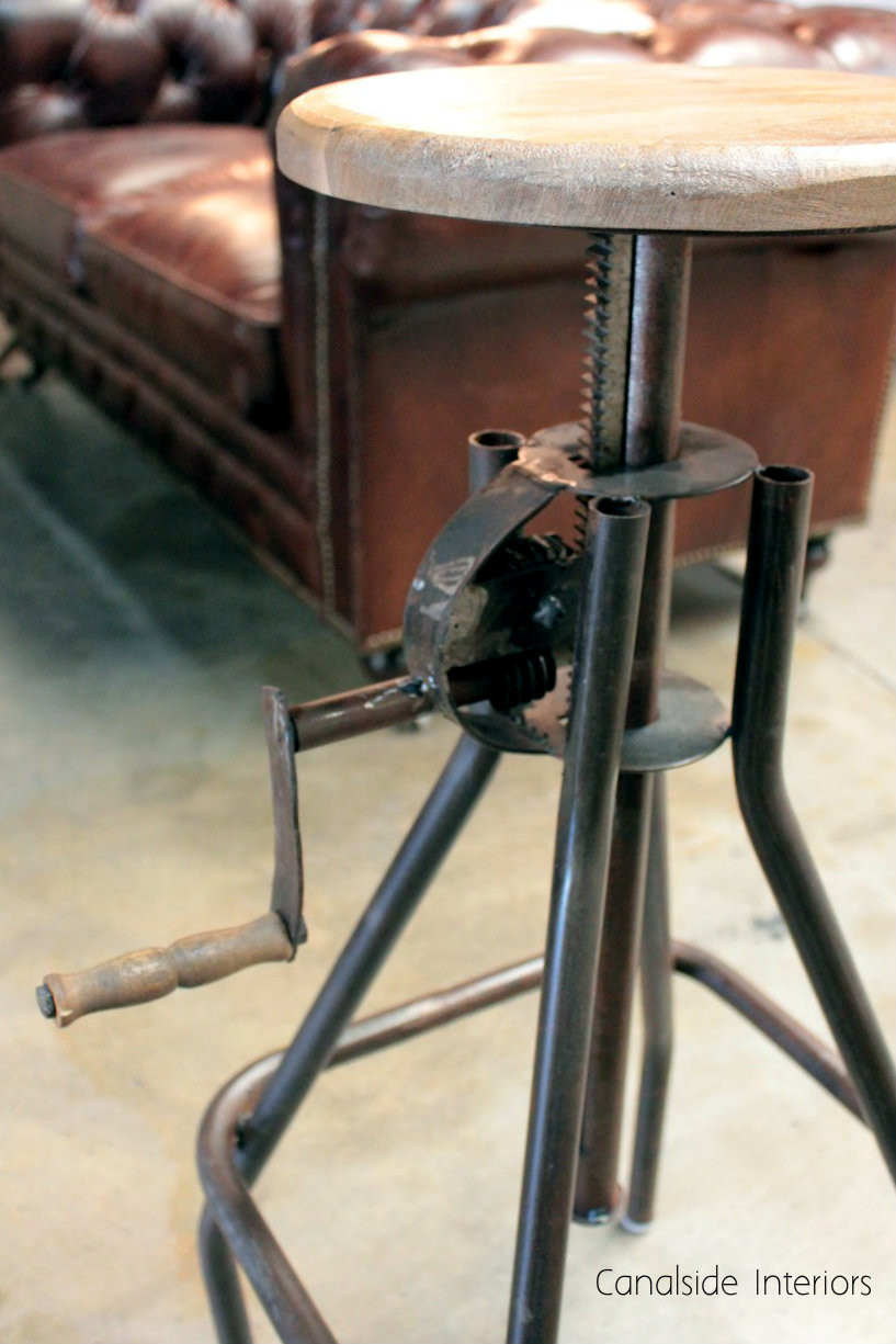 Canalside Interiors' Cruz Stool, in bar height with an adjustable seat, showcases classical craftsmanship with an industrial twist, suitable for any dining room.