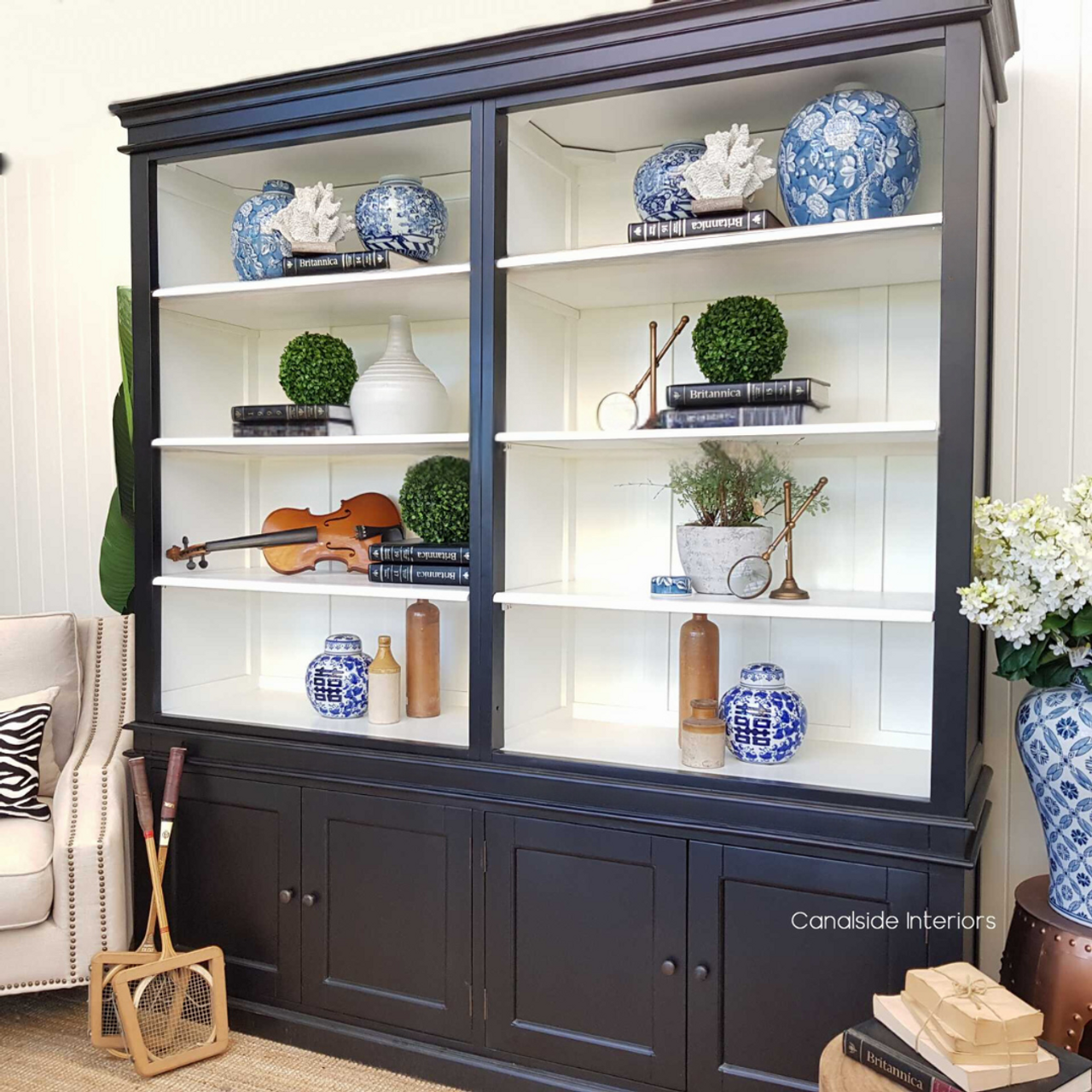 Angle view capturing the full height and elegant stature of the Grange Wall Unit. Craft a modern yet timeless workspace with the Grange 4 Door Wall Unit, blending seamlessly into any home office setting - Canalside Interiors