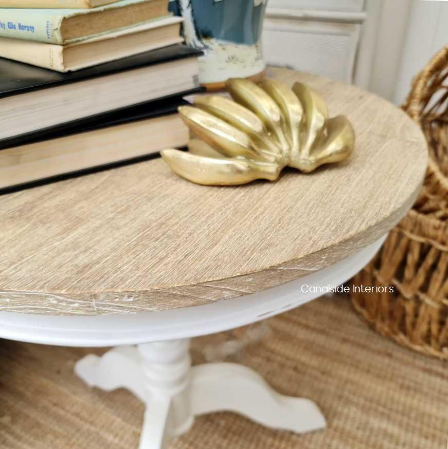 Paired with luxury decor items, illustrating the table's versatility as an accent piece.