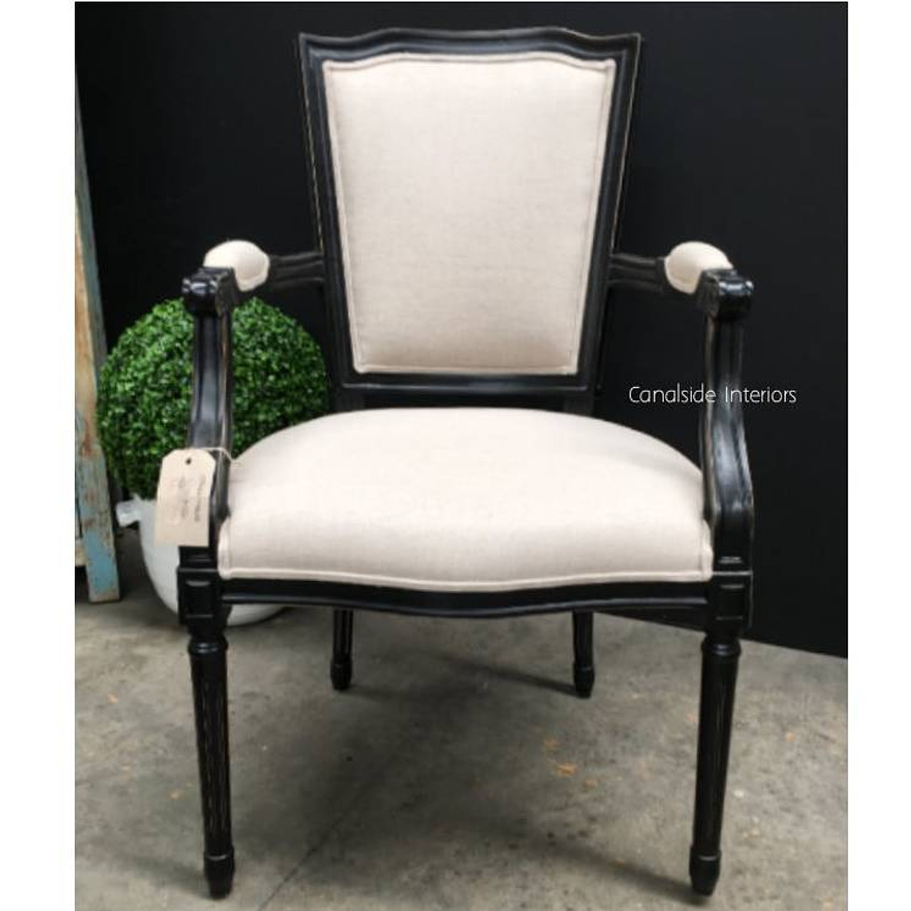 With a shaped back and elegant frame, the Stark Carver Chair from Canalside Interiors is a signature piece for any timeless interior