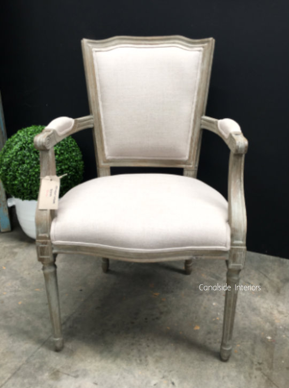 Designed for discerning tastes, the weathered oak Stark Carver Chair with cream upholstery from Canalside Interiors enriches your home with its timeless appeal.