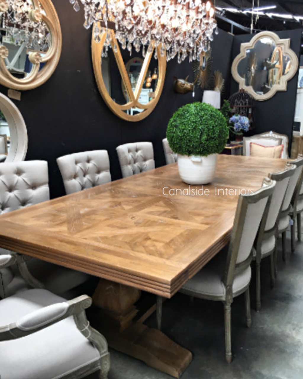 The Artisan dining table in a lively family room, serving as the heart of home gatherings and a centerpiece of conversation.