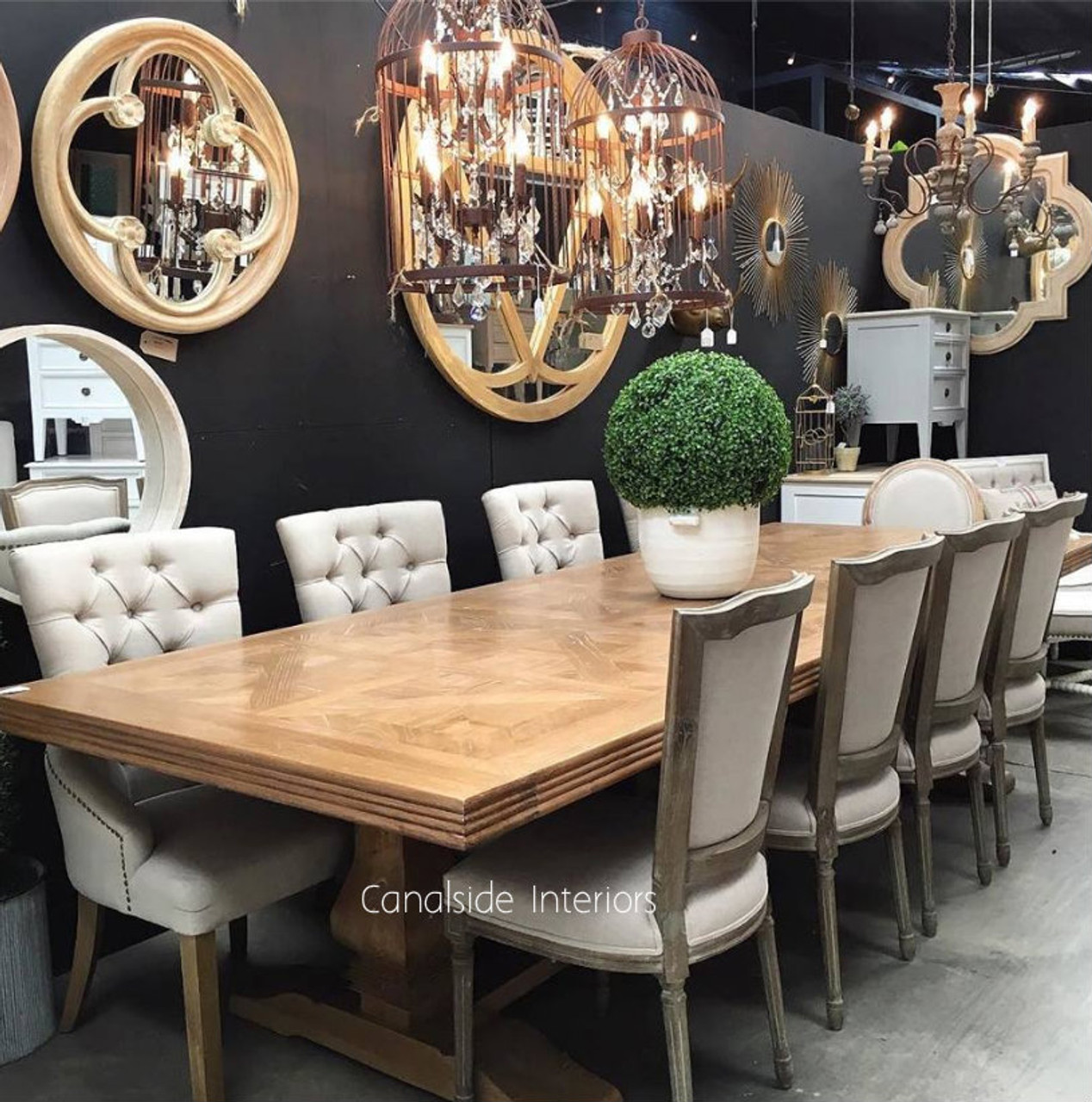 The Artisan Parquetry Top Dining Table amidst contemporary decor, showcasing its ability to blend with modern and traditional styles alike.