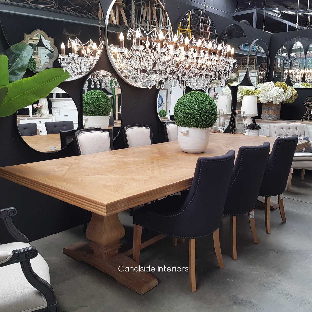 The table adorned for a luxurious dinner party, demonstrating its capacity to elevate any dining experience with its rustic elegance.