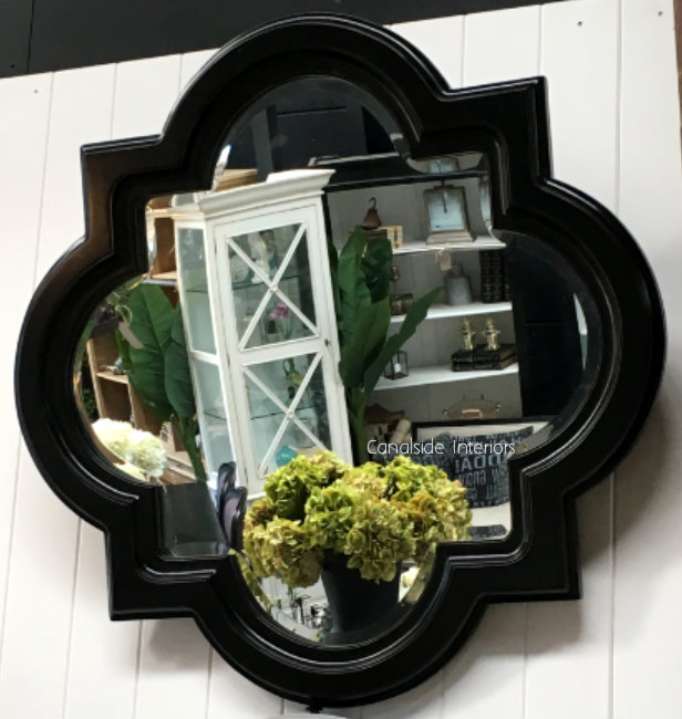 Close-up showing the intricate details and craftsmanship of the Cadence mirror's frame in distressed black.