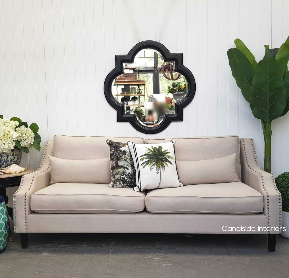 Styled setting, illustrating how the Cadence mirror complements both modern and classical furnishings.