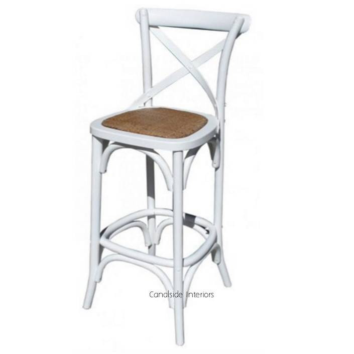 Viewed from the front, the Cross Back Bar Stool in distressed white from Canalside Interiors presents a classic Hamptons aesthetic that can transform a dining room with its timeless appeal