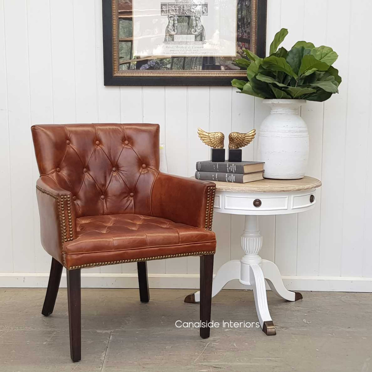 The Memphis Leather Armchair styled in a modern living room, offering a touch of classical elegance