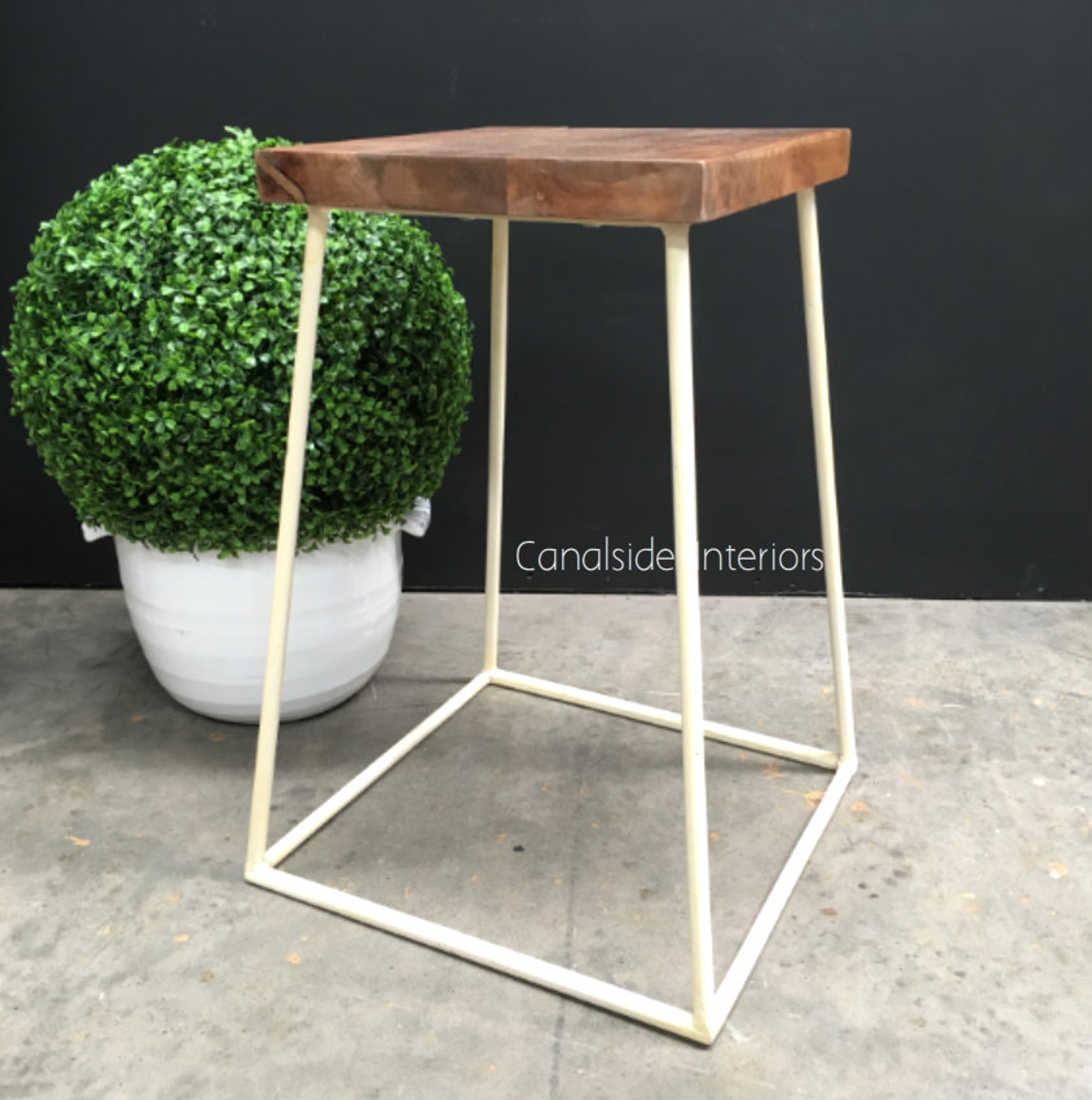 Front view of the Minimalist Bar Stool in distressed off-white/cream with a wooden seat, showcasing its modern angular design - perfect for contemporary kitchens.