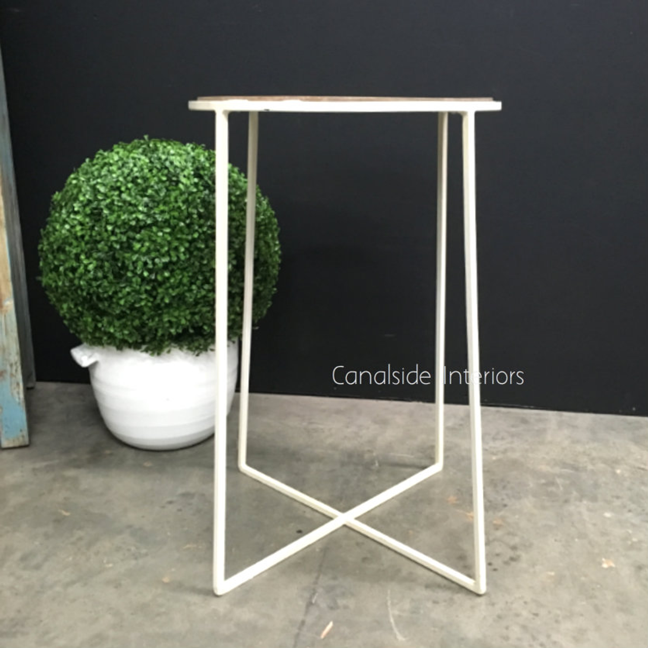 Angled shot demonstrating the table's height and the elegant proportion in relation to surrounding furniture.