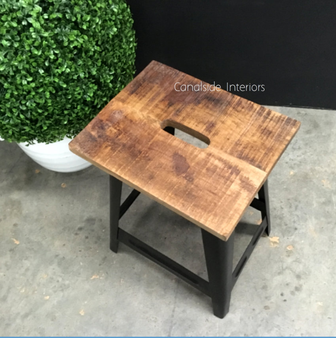 Elevate your living room with the classical design of the Garden Drive Stool, where Canalside Interiors' quality craftsmanship meets rustic charm