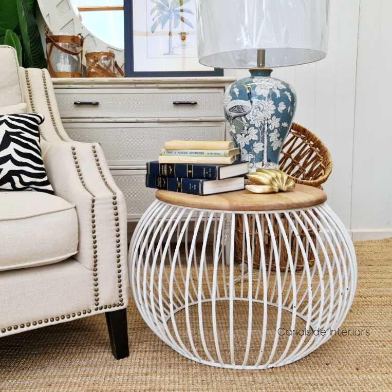 Full view of the Cabana Coffee Table, highlighting the contrast between the distressed white base and natural wood top.